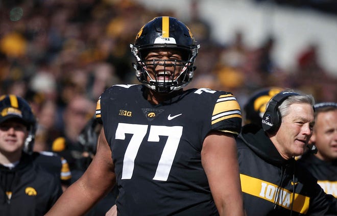 Iowa left tackle Alaric Jackson gets pumped up after members of the Hawkeyes defense recovered a fumble in the end zone against Maryland on Saturday, Oct. 20, 2018, at Kinnick Stadium in Iowa City.