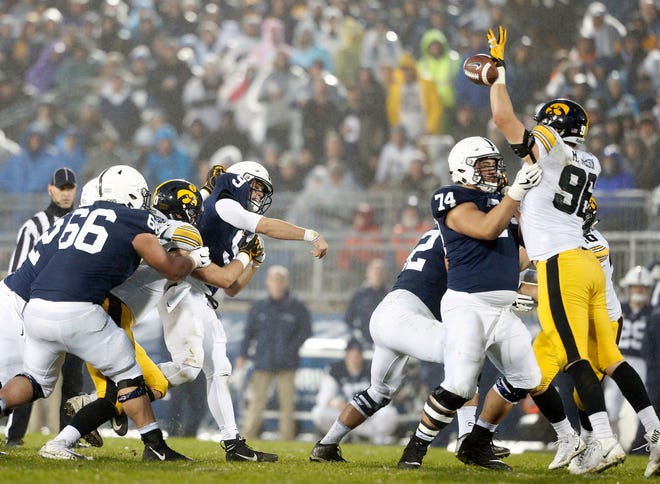 Penn State quarterback Trace McSorley (9) has his pass knocked down by Iowa's Matt Nelson (96) during the second half of an NCAA college football game in State College, Pa., Saturday, Oct. 27, 2018. (AP Photo/Chris Knight)