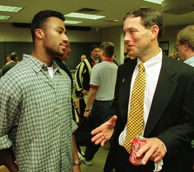 From 1998: New Iowa football coach Kirk Ferentz talks with Hawkeyes wide receiver Kahlil Hill following the press conference in Iowa City where Ferentz was introduced.