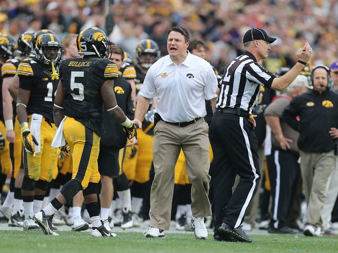 Iowa offensive line coach Brian Ferentz tries to generate a pass interference call after receiver Damon Bullock was hit by LSU's Craig Loston on Wednesday, Jan. 1, 2014, in Tampa, Florida. (Bryon Houlgrave/The Register)
