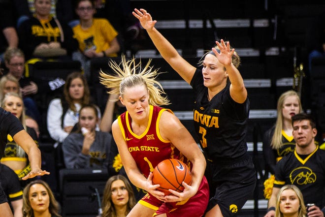 Iowa State forward Madison Wise (1) gets defended by Iowa guard Makenzie Meyer (3) during a Cy-Hawk series NCAA women's basketball game on Wednesday, Dec. 5, 2018, at Carver-Hawkeye Arena in Iowa City.