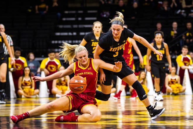 Iowa State forward Madison Wise (1) and Iowa guard Makenzie Meyer (3) wrestle for a loose ball during a Cy-Hawk series NCAA women's basketball game on Wednesday, Dec. 5, 2018, at Carver-Hawkeye Arena in Iowa City.