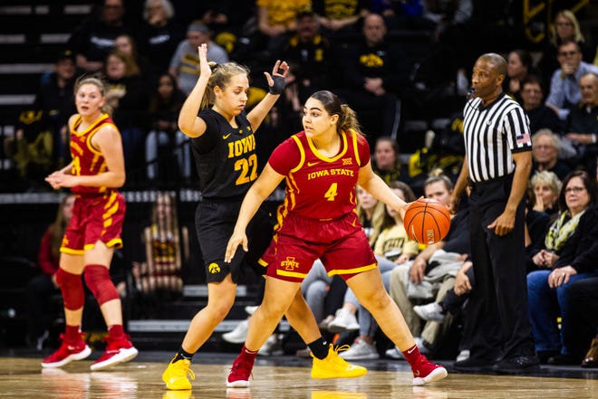 Iowa guard Kathleen Doyle (22) defends Iowa State guard Rae Johnson (4) during a Cy-Hawk series NCAA women's basketball game on Wednesday, Dec. 5, 2018, at Carver-Hawkeye Arena in Iowa City.