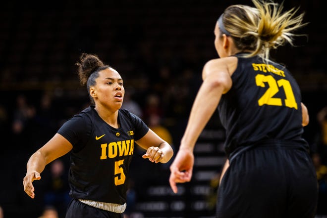 Iowa guard Alexis Sevillian (5) high-fives Iowa forward Hannah Stewart (21) during a Cy-Hawk series NCAA women's basketball game on Wednesday, Dec. 5, 2018, at Carver-Hawkeye Arena in Iowa City.