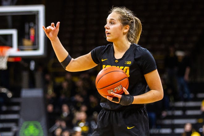 Iowa guard Kathleen Doyle calls out to teammates during a Cy-Hawk series NCAA women's basketball game on Wednesday, Dec. 5, 2018, at Carver-Hawkeye Arena in Iowa City.