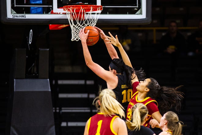 Iowa forward Megan Gustafson (10) grabs a rebound to break the school record during a Cy-Hawk series NCAA women's basketball game on Wednesday, Dec. 5, 2018, at Carver-Hawkeye Arena in Iowa City.