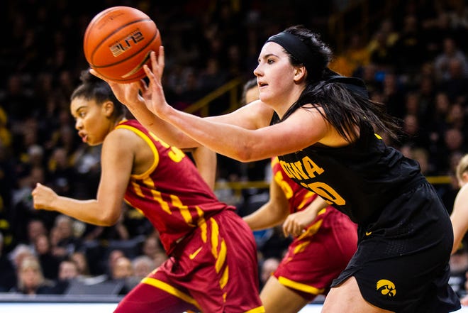 Iowa forward Megan Gustafson (10) passes after grabbing a rebound during a Cy-Hawk series NCAA women's basketball game on Wednesday, Dec. 5, 2018, at Carver-Hawkeye Arena in Iowa City.