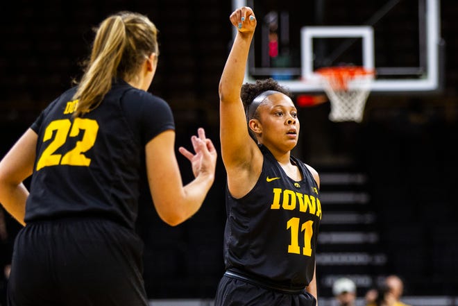 Iowa guard Tania Davis (11) celebrates after making a 3-point basket during a Cy-Hawk series NCAA women's basketball game on Wednesday, Dec. 5, 2018, at Carver-Hawkeye Arena in Iowa City.