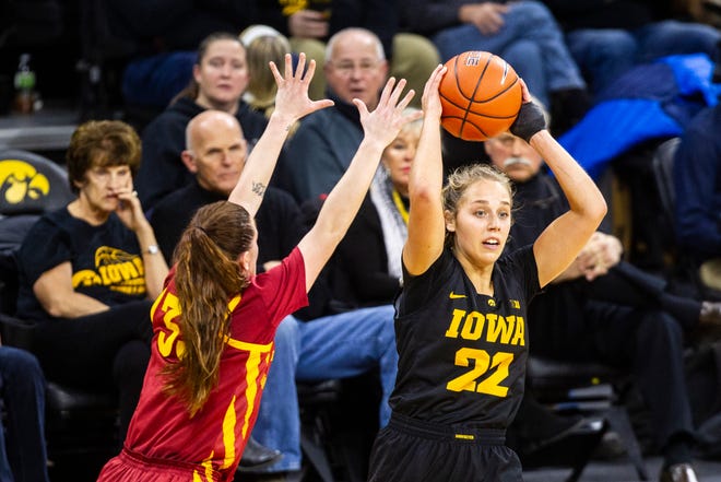 Iowa guard Kathleen Doyle (22) looks to pass during a Cy-Hawk series NCAA women's basketball game on Wednesday, Dec. 5, 2018, at Carver-Hawkeye Arena in Iowa City.