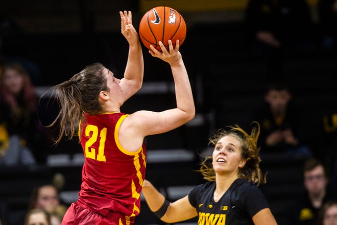 Iowa State guard Bridget Carleton (21) attempts a basket past Iowa guard Kathleen Doyle during a Cy-Hawk series NCAA women's basketball game on Wednesday, Dec. 5, 2018, at Carver-Hawkeye Arena in Iowa City.