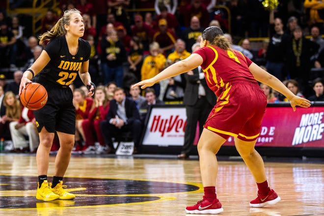 Iowa guard Kathleen Doyle (22) looks up to the shot clock while time expires during a Cy-Hawk series NCAA women's basketball game on Wednesday, Dec. 5, 2018, at Carver-Hawkeye Arena in Iowa City.