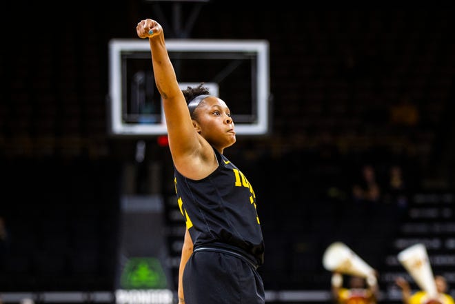 Iowa guard Tania Davis (11) watches as her 3-point basket land during a Cy-Hawk series NCAA women's basketball game on Wednesday, Dec. 5, 2018, at Carver-Hawkeye Arena in Iowa City.
