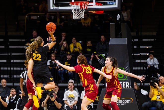 Iowa guard Kathleen Doyle (22) attempts a basket during a Cy-Hawk series NCAA women's basketball game on Wednesday, Dec. 5, 2018, at Carver-Hawkeye Arena in Iowa City.