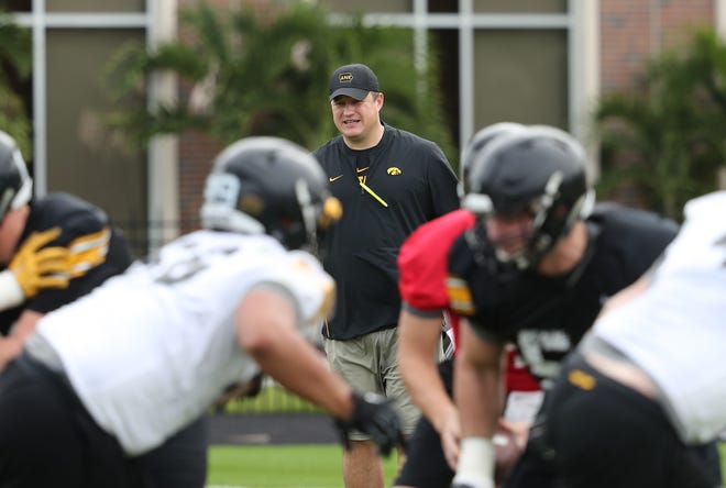 In this University of Iowa photo from Thursday's closed practice, offensive coordinator Brian Ferentz oversees his starting first unit. For more photos, visit HawkeyeSports.com.