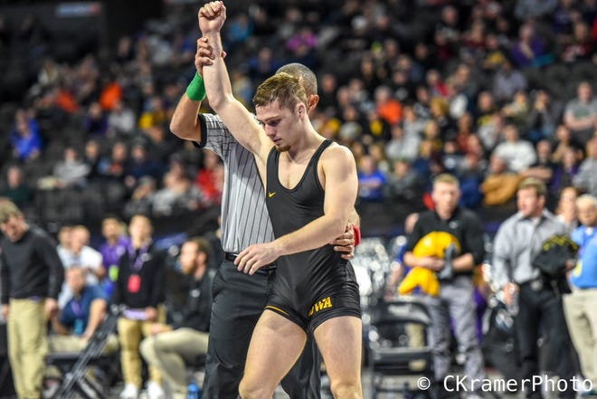 Iowa's Spencer Lee gets his hand raised after winning a match at the 2018 Midlands Championships. Lee reached the finals at 125 pounds.