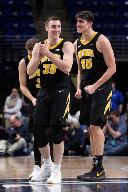 Jan 16, 2019; University Park, PA, USA; Iowa Hawkeyes guard Connor McCaffery (30) and forward Luka Garza (55) react in the final seconds of the second half against the Penn State Nittany Lions at Bryce Jordan Center. Iowa defeated Penn State 89-82. Mandatory Credit: Matthew O'Haren-USA TODAY Sports