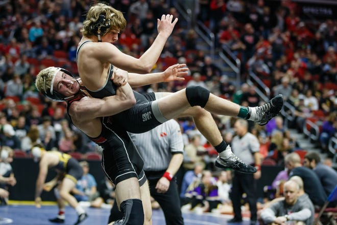 Dakota Southworth of Cedar Falls wrestles Logan Neils of Ankeny Centennial during their 3A 170 lb match at the state wrestling tournament on Thursday, Feb. 14, 2019 in Des Moines.