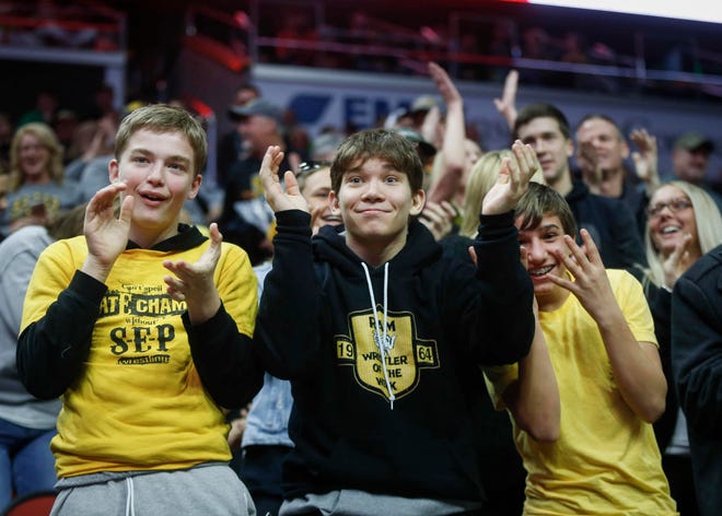 Southeast Polk high school fans cheer as Lance Runyon spent all of nine seconds before pinning Waverly-Shell Rock's Kurt Fay during the 2019 Iowa high school dual wrestling state tournament on Wednesday, Feb. 13, 2019, at Wells Fargo Arena in Des Moines.