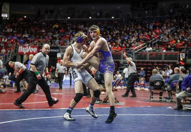 South Central Calhoun senior Chase McAlister tries to score a takedown on Lake Mills sophomore Elijah Wagner in their match at 160 pounds during the opening round of Class 1A matches during the Iowa high school state wrestling tournament at Wells Fargo Arena on Thursday, Feb. 14, 2019, in Des Moines.