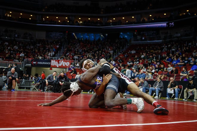 Deville Dentis of Des Moines East wrestles Jermaine Sammler of Wakee during their 3A 145 lb match at the state wrestling tournament on Thursday, Feb. 14, 2019 in Des Moines.