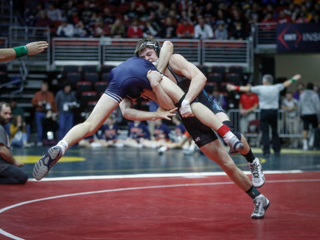 East Union junior Sherman Hayes, right, takes Southwest Valley senior Teagan Lundquist back to the mat in their match at 138 pounds during the opening round of Class 1A matches during the Iowa high school state wrestling tournament at Wells Fargo Arena on Thursday, Feb. 14, 2019, in Des Moines.