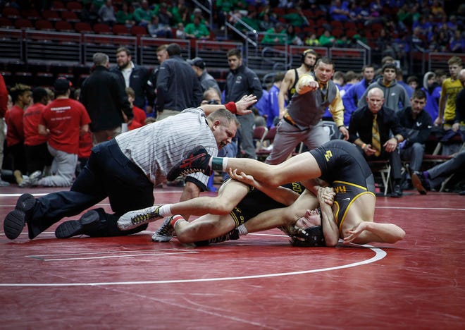 Waverly-Shell Rock's Dylan Albrecht pins Southeast Polk's Carter Martinson at 126 pounds during the 2019 Iowa high school dual wrestling state tournament on Wednesday, Feb. 13, 2019, at Wells Fargo Arena in Des Moines.