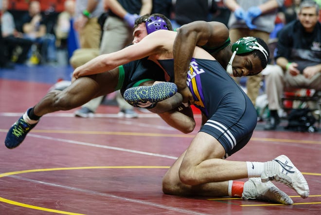 Anthony Zach of Waukee wrestles Arthur Sumie of Des Moines North during their 3A 170 lb match at the state wrestling tournament on Thursday, Feb. 14, 2019 in Des Moines.