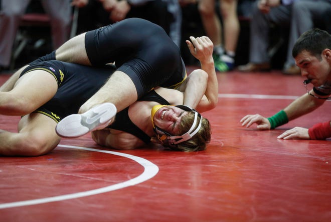 Southeast Polk's Camden Baarda collects back points on  Waverly-Shell Rock's Cayden Langreck at 145 pounds during the 2019 Iowa high school dual wrestling state tournament on Wednesday, Feb. 13, 2019, at Wells Fargo Arena in Des Moines.