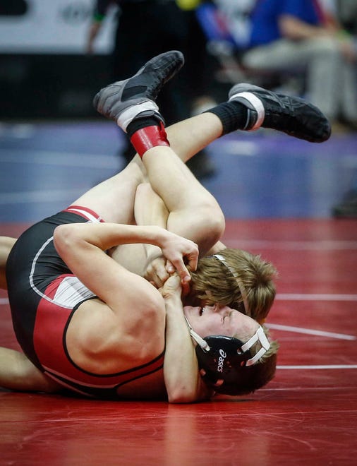 Oakland Riverside sophomore Mick Schroder pins North Mahaska freshman Michael Dejong in their match at 113 pounds during the opening round of Class 1A matches during the Iowa high school state wrestling tournament at Wells Fargo Arena on Thursday, Feb. 14, 2019, in Des Moines.