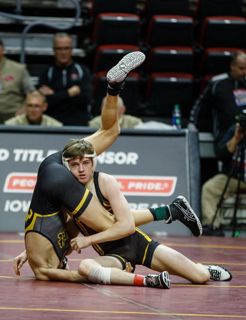 Caleb Rathjen of Ankeny wrestles Kohler Ruggles of Bettendorf during their 3A 126 lb match at the state wrestling tournament on Thursday, Feb. 14, 2019 in Des Moines.