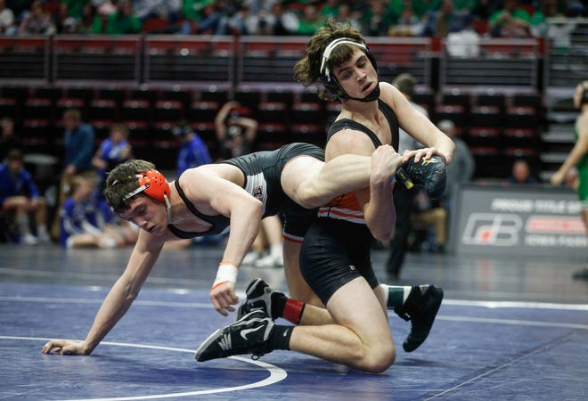Solon's Andy Brokaw, right, pulls away from West Delaware's Wyatt Voelker in their match at 170 during the 2019 Iowa high school dual wrestling state tournament on Wednesday, Feb. 13, 2019, at Wells Fargo Arena in Des Moines.