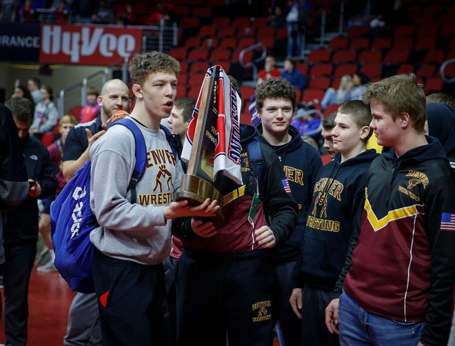 Members of the Denver wrestling team hold the Class 1A runner up trophy during the 2019 Iowa high school dual wrestling state tournament on Wednesday, Feb. 13, 2019, at Wells Fargo Arena in Des Moines.