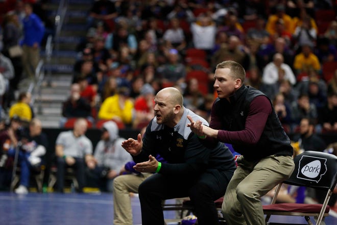 Denver coaches explode out of their seats as Cael Krueger wrestles Western Christian sophomore Tristan Mulder at 170 pounds during the opening round of Class 1A matches during the Iowa high school state wrestling tournament at Wells Fargo Arena on Thursday, Feb. 14, 2019, in Des Moines.