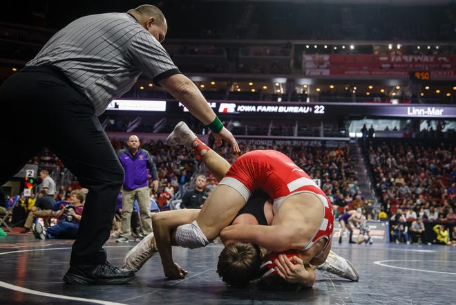 Cade Moss of Johnston wrestles Bain Broderick of Dallas Center- Grimes during their 3A 152 lb match at the state wrestling tournament on Thursday, Feb. 14, 2019 in Des Moines.