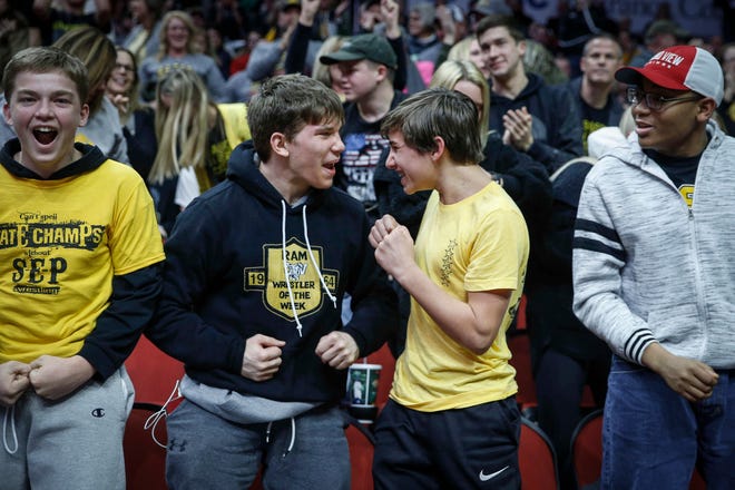 Southeast Polk high school fans cheer as Joel Jesuroga pinned Waverly-Shell Rock's Zack Barnett in Class 3A during the 2019 Iowa high school dual wrestling state tournament on Wednesday, Feb. 13, 2019, at Wells Fargo Arena in Des Moines.