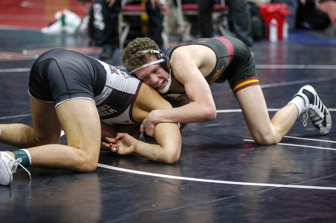 Denver senior Cael Krueger tries to score a late takedown against Western Christian sophomore Tristan Mulder at 170 pounds during the opening round of Class 1A matches during the Iowa high school state wrestling tournament at Wells Fargo Arena on Thursday, Feb. 14, 2019, in Des Moines.