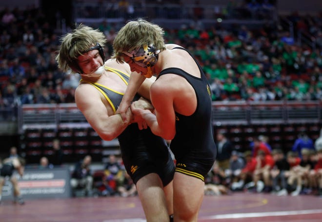 Southeast Polk's Camden Baarda, left, controls Waverly-Shell Rock's Cayden Langreck at 145 pounds during the 2019 Iowa high school dual wrestling state tournament on Wednesday, Feb. 13, 2019, at Wells Fargo Arena in Des Moines.