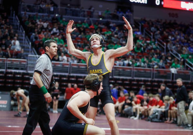 Southeast Polk's Lance Runyon celebrates after a 9-second win by fall over Waverly-Shell Rock's Kurt Fay at 152 pounds during the 2019 Iowa high school dual wrestling state tournament on Wednesday, Feb. 13, 2019, at Wells Fargo Arena in Des Moines.