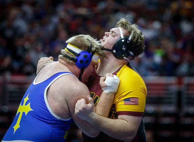 Denver senior Brock Farley, right, clashes with Don Bosco senior Noah Pittman in their match at 285 pounds during the opening round of Class 1A matches during the Iowa high school state wrestling tournament at Wells Fargo Arena on Thursday, Feb. 14, 2019, in Des Moines.