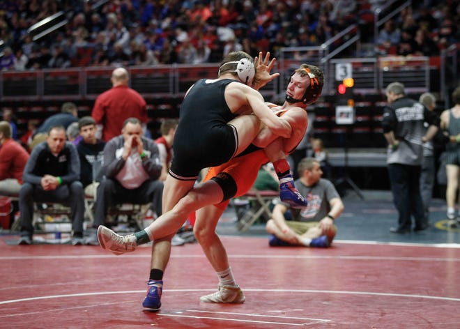 West Des Moines Valley's Nick Oldham trips up Fort Dodge's Brooks Cowell in their match at 126 pounds during the state wrestling quarterfinals on Friday, Feb. 15, 2019, at Wells Fargo Arena in Des Moines.