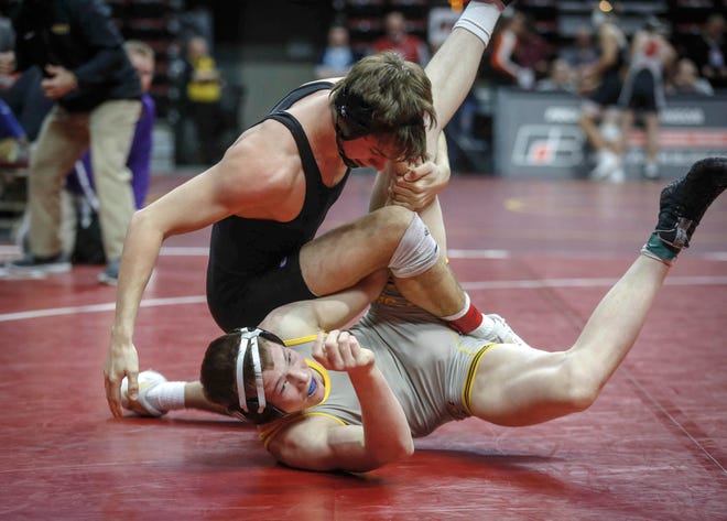Johnston senior Cade Moss breaks down Waverly-Shell Rock senior Bryson Hervol in their match at 152 pounds during the state wrestling quarterfinals on Friday, Feb. 15, 2019, at Wells Fargo Arena in Des Moines.