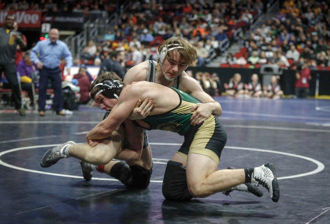 Ankeny Centennial senior Nic Leo battles Iowa City West junior Will Hoeft in their match at 182 pounds during the state wrestling quarterfinals on Friday, Feb. 15, 2019, at Wells Fargo Arena in Des Moines.