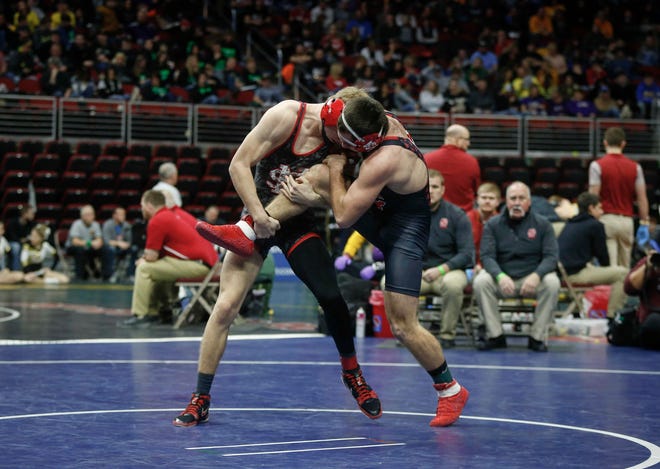 Iowa City High senior Kyle Hefley, right, is taken down by North Scott junior Jake Matthaidess in their match at 152 pounds during the state wrestling quarterfinals on Friday, Feb. 15, 2019, at Wells Fargo Arena in Des Moines.