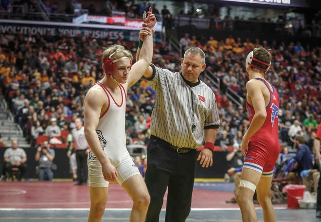 Lisbon junior Cael Happel won by injury default over West Sioux-Hawarden junior Dillon Lynott in their match at 132 pounds during the state wrestling quarterfinals on Friday, Feb. 15, 2019, at Wells Fargo Arena in Des Moines.