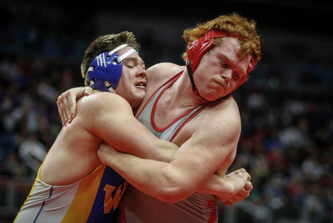 West Hancock junior Chandler Redenius, right, battles Westwood senior Trenton Dirks in their match at 285 pounds during the state wrestling quarterfinals on Friday, Feb. 15, 2019, at Wells Fargo Arena in Des Moines.