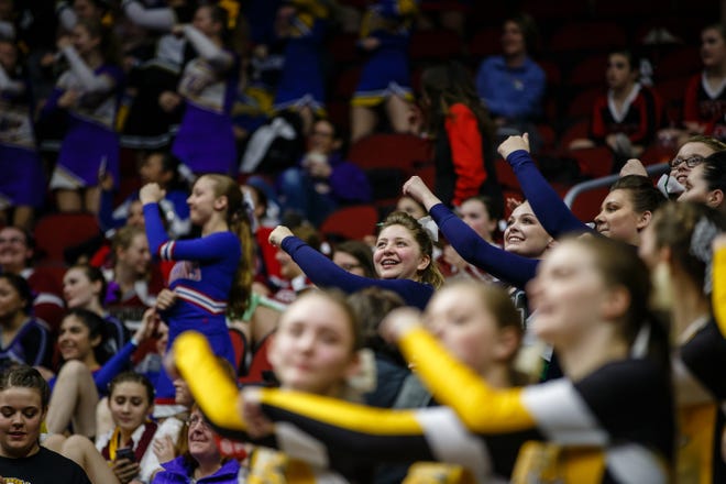 Cheerleaders dance in the stands before the 1A state championship semi-final round on Friday, Feb. 15, 2019 in Des Moines.