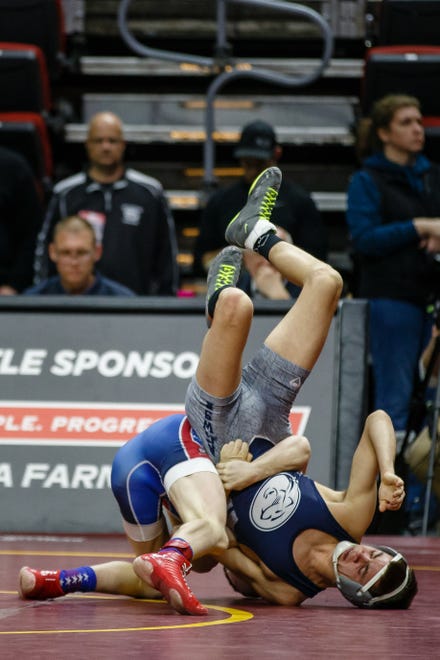 Adam Allard of West Sioux wrestles Trey Lashbrook of AGWSR during their class 1A 120 pound state championship semi-final match on Friday, Feb. 15, 2019 in Des Moines. Allard moves onto the finals with a 10-1 major decision.