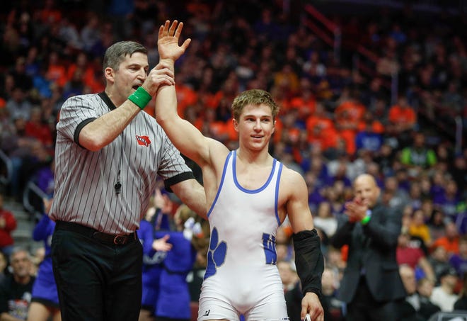 Woodbury Central junior Wade Mitchell celebrates after beating Emmetsburg senior Spencer Griffin for a Class 1A state title win at 145 pounds on Saturday, Feb. 16, 2019, at Wells Fargo Arena in Des Moines.
