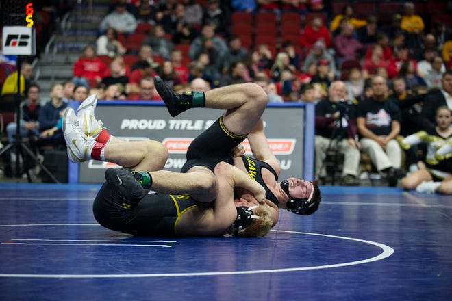 Southeast Polk's Gabe Christenson wrestles Waverly-Shell Rock's Brayden Wolf during the 195 pound class 3A championship match during the Iowa high school state wrestling tournament on Saturday, Feb. 16, 2019, in Wells Fargo Arena.