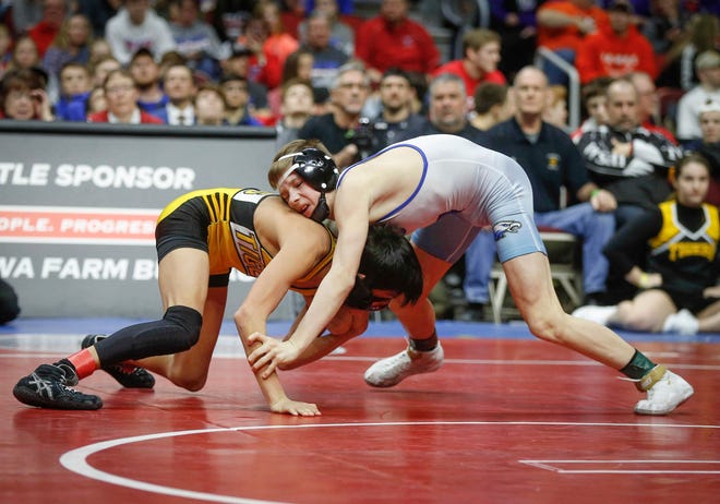 New London freshman Marcel Lopez shoots in on Underwood's Stevie Barnes in their match art 106 pounds during the state wrestling Class 1A championship on Saturday, Feb. 16, 2019, at Wells Fargo Arena in Des Moines.